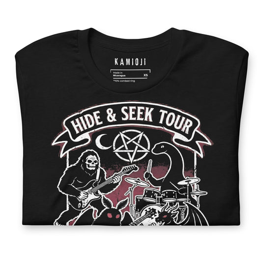 Graphic tee with Sasquatch playing guitar alongside Mothman and the Loch Ness Monster in a band scene.