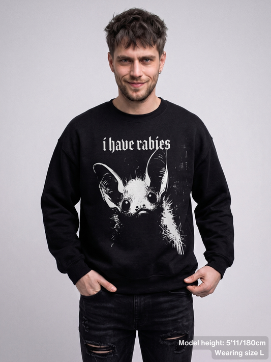 Male model wearing the KAMIOJI I Have Rabies graphic sweatshirt featuring a distressed gothic bat design | Colour: Black