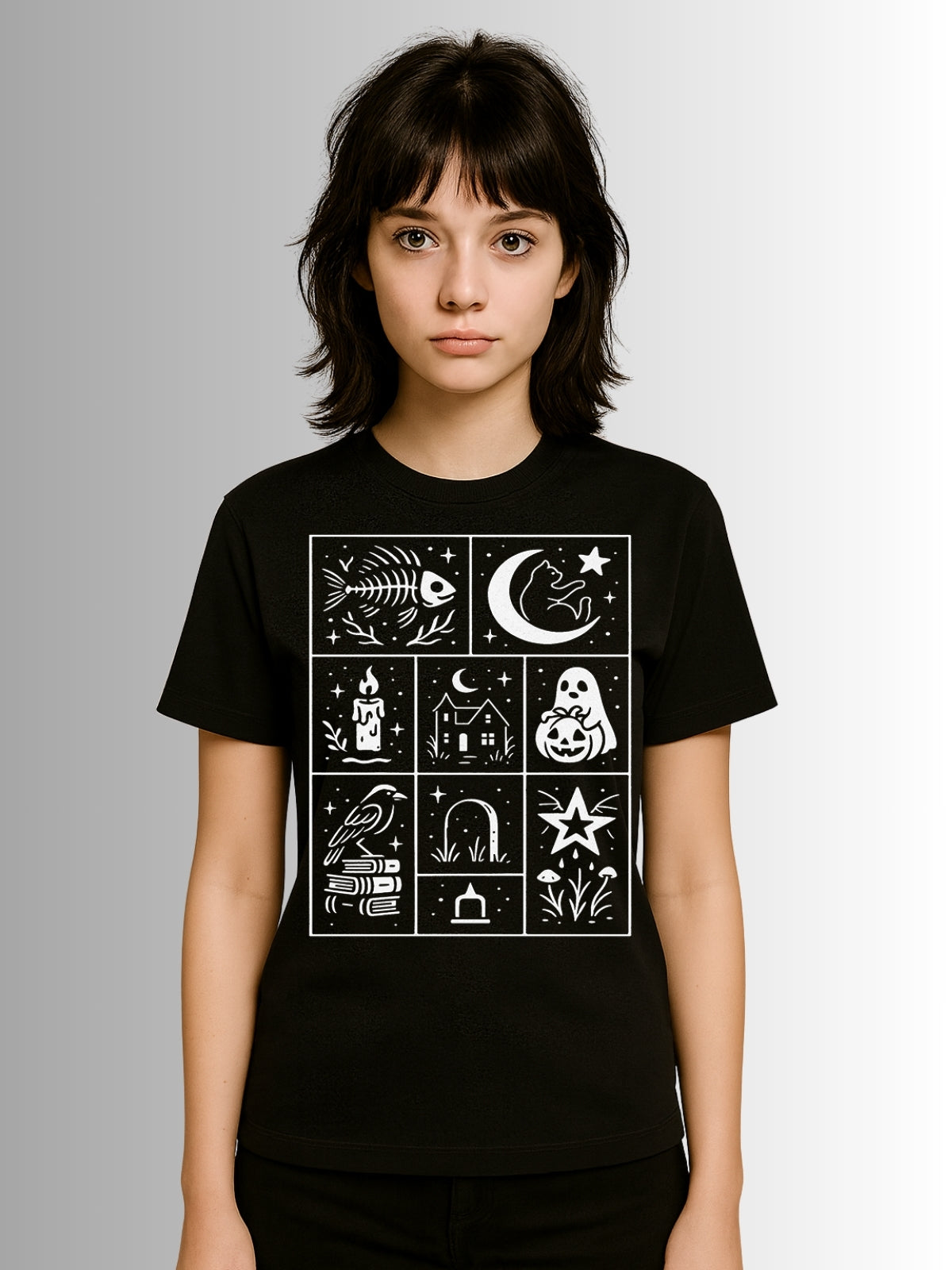 Alternative black T-shirt with playful Halloween pattern of ghosts, pumpkins, candles, and celestial motifs