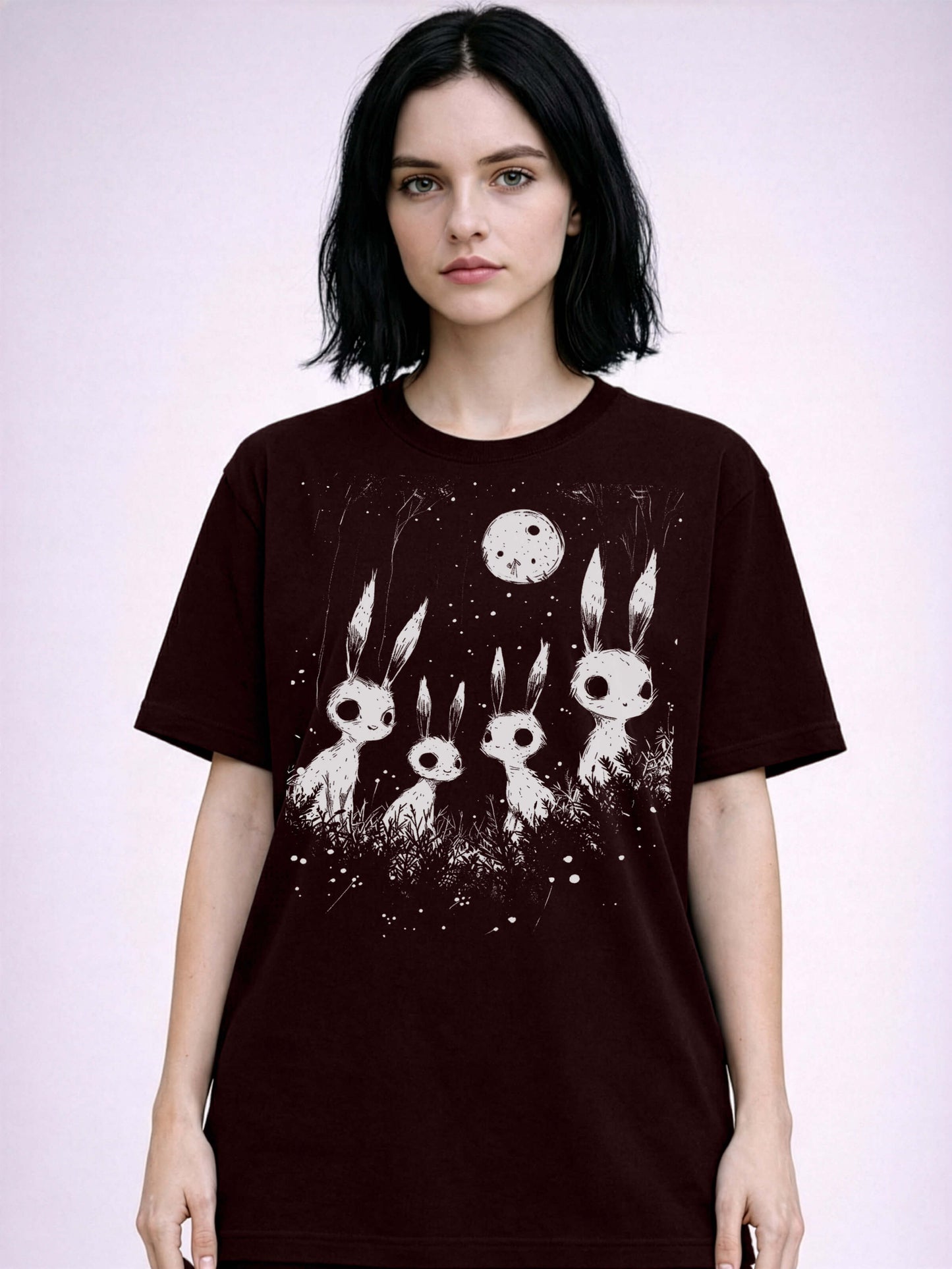Oxblood black Dark art graphic tee featuring spooky skeletal rabbits and moonlit forest scene
