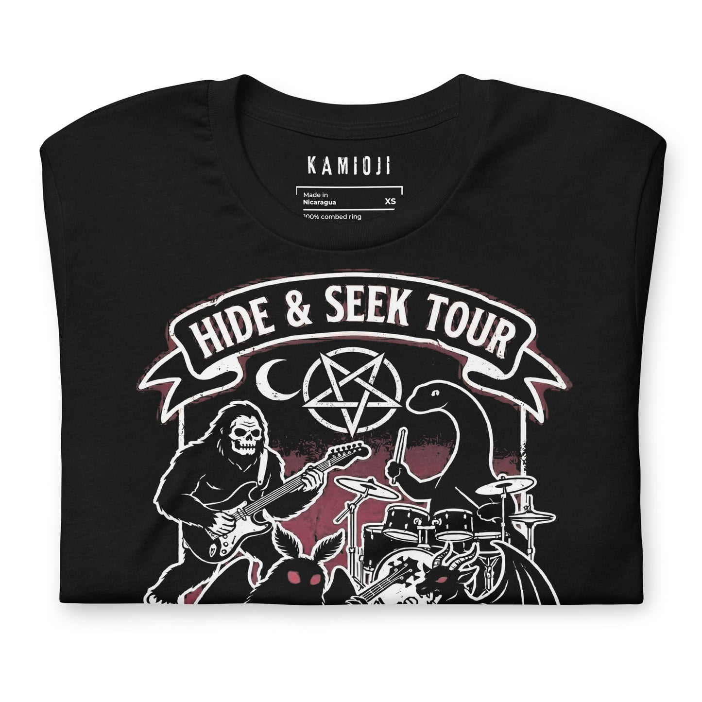 Graphic tee with Sasquatch playing guitar alongside Mothman and the Loch Ness Monster in a band scene.
