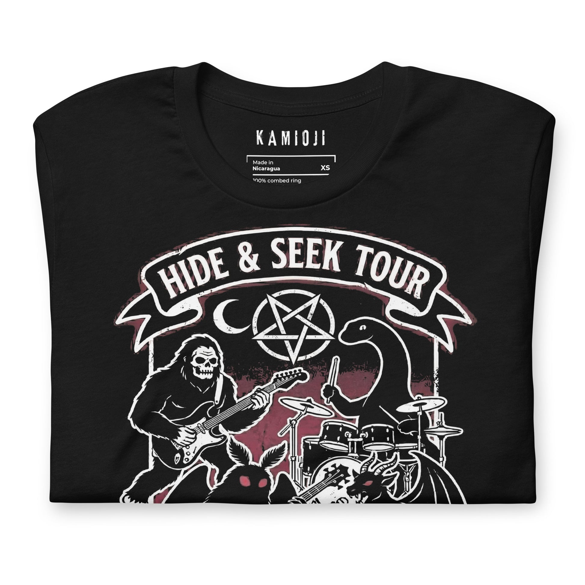 Graphic tee with Sasquatch playing guitar alongside Mothman and the Loch Ness Monster in a band scene.