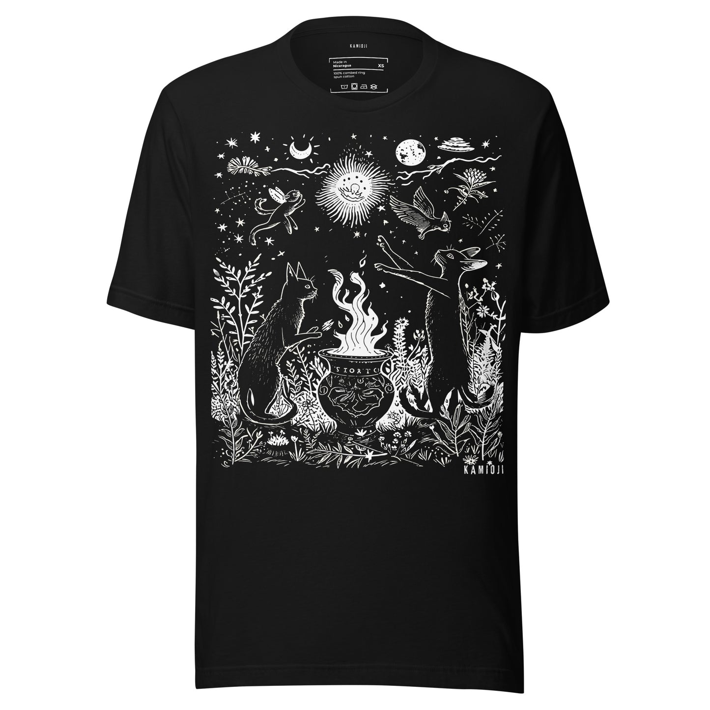 Unisex t shirt with an occult inspired illustration of cats performing a ritual around a cauldron beneath celestial elements.
