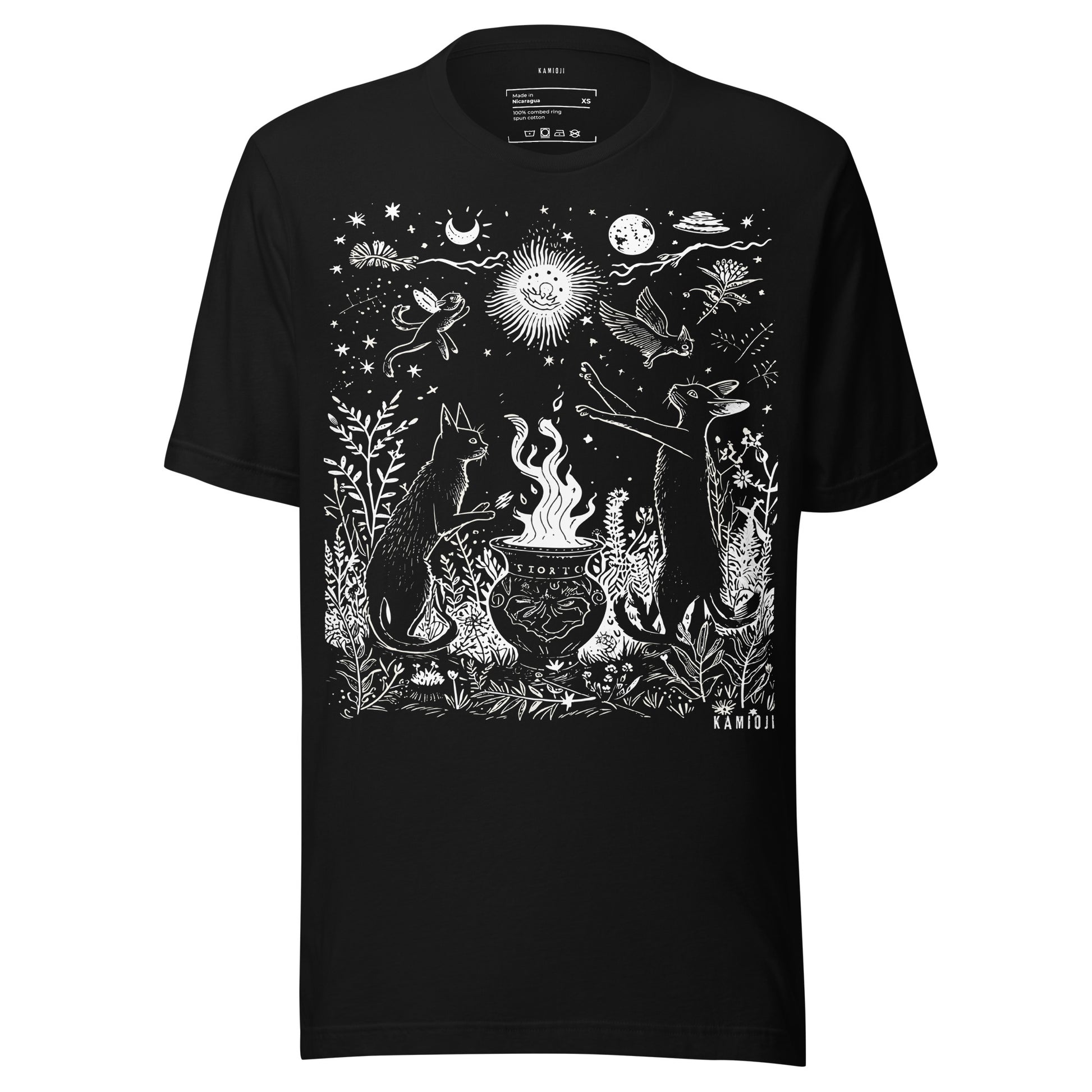 Unisex t shirt with an occult inspired illustration of cats performing a ritual around a cauldron beneath celestial elements.