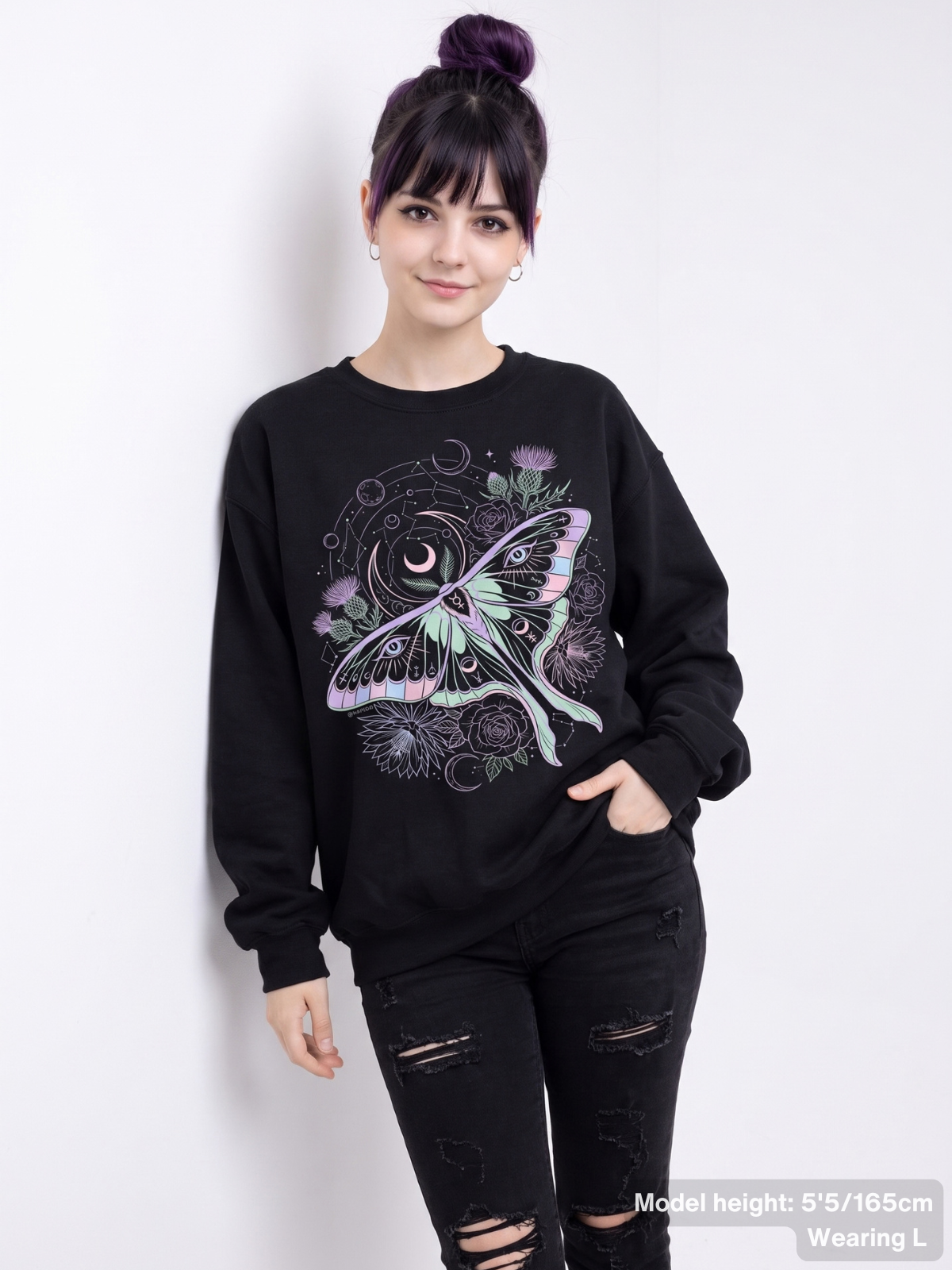 Female model wearing the KAMIOJI celestial luna moth graphic sweatshirt featuring moons, flowers and mystical eye details | Colour: Black