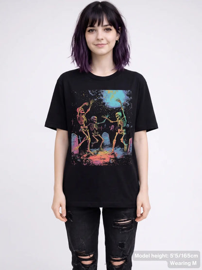 Dancing skeleton graphic tee featuring three skeletons celebrating in a graveyard beneath a full moon with tombstones and spooky artwork. | Colour: Black