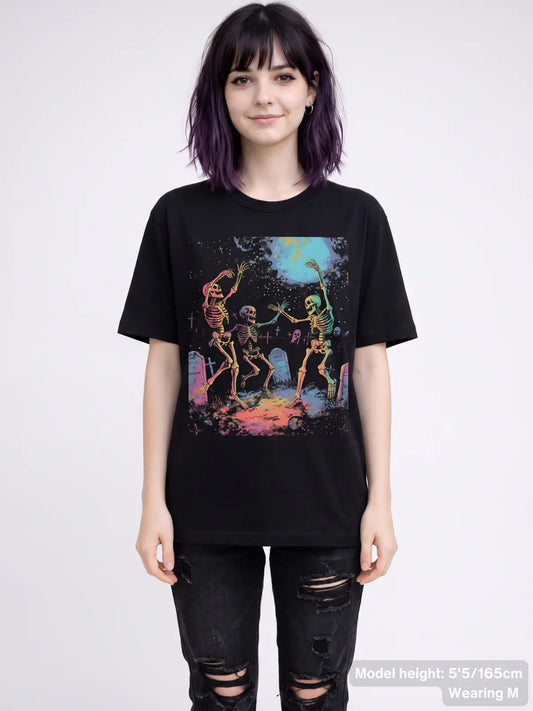 Dancing skeleton graphic tee featuring three skeletons celebrating in a graveyard beneath a full moon with tombstones and spooky artwork. | Colour: Black