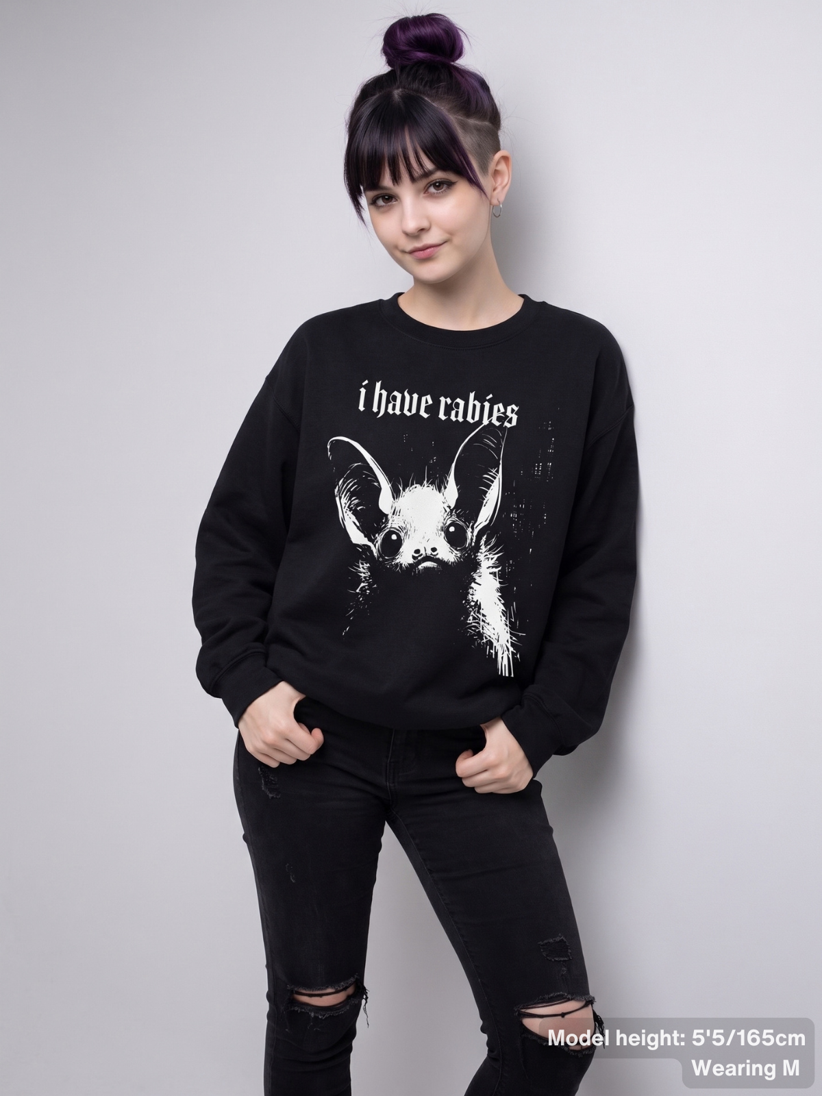 Female model wearing the KAMIOJI I Have Rabies bat sweatshirt with a distressed gothic graphic | Colour: Black