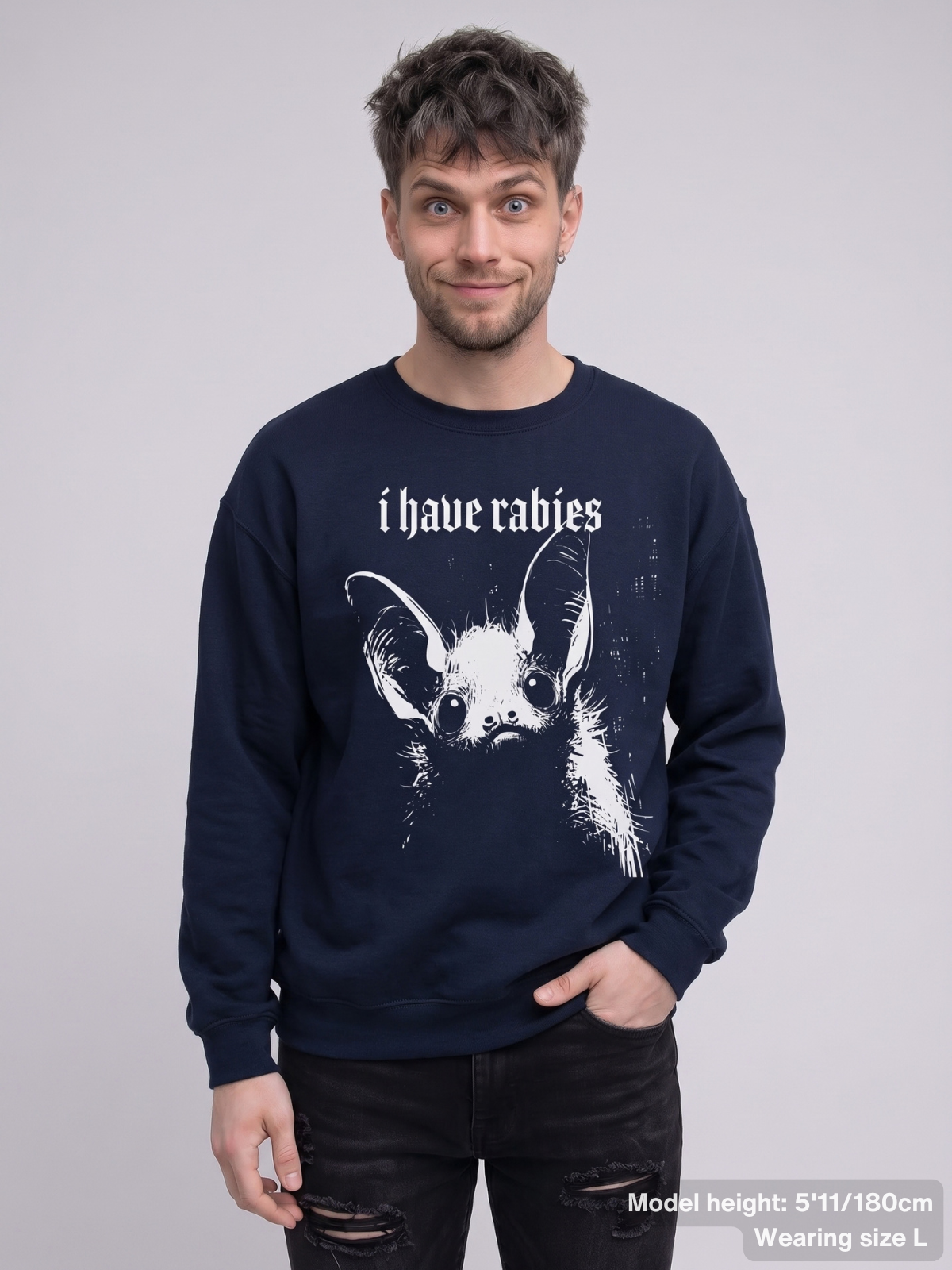 Male model wearing the KAMIOJI I Have Rabies bat sweatshirt with a distressed gothic graphic | Colour: Navy