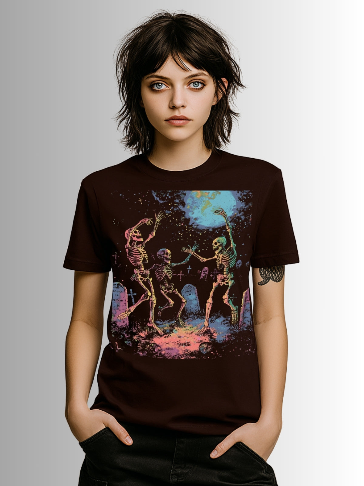 Gothic streetwear shirt with three skeletons dancing under a glowing moon in a cemetery