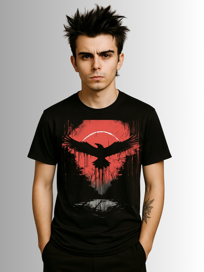 Alternative black T-shirt with moody raven illustration set against red sunset and shadowy woodland design