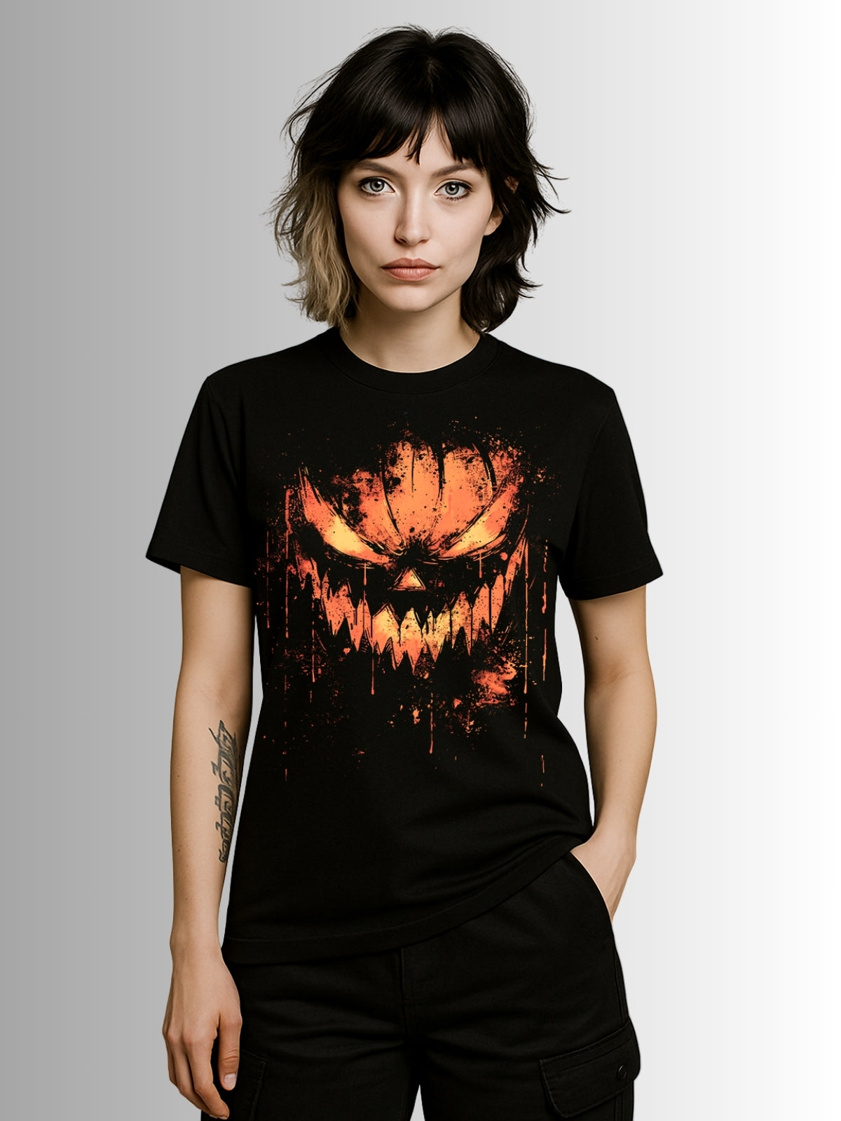 Black alternative T-shirt with sinister pumpkin grin and fiery orange splatter effect for a dark Halloween look