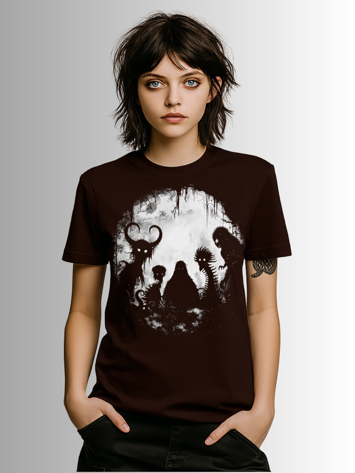 Oxblood black gothic tee with cryptid lineup artwork including Mothman, Bigfoot, and mythical beings